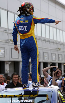 Andrew Jordan on top of the world after winning race 2