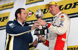 Alan Gow presents Matt Neal with his 2011 BTCC Drivers' Championship  trophy