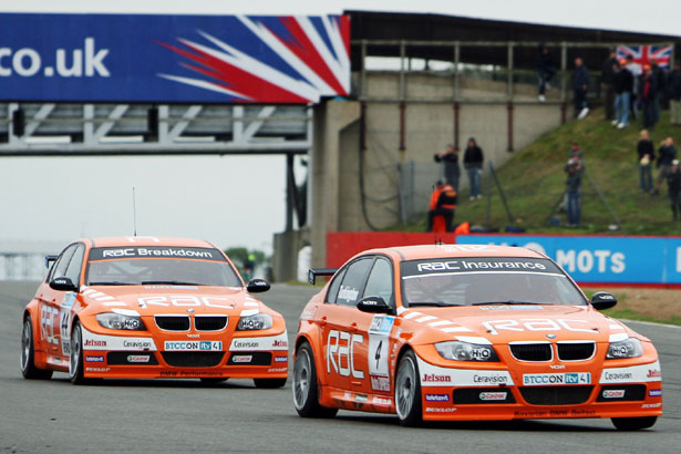 Colin Turkington leading his team-mate in the 2009 BTCC season