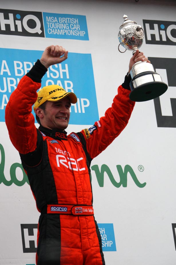 Colin Turkington lifting the 2009 British Touring Car Championship trophy