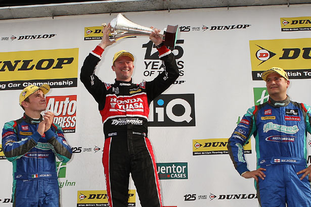 Gordon Shedden on the podium with Aron Smith and Mat Jackson