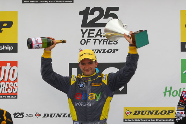 Colin Turkington celebrates winning the first race at Knockhill