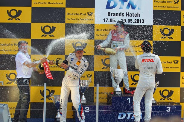 Rockenfeller celebrates with Bruno Spengler and Robert Wickens