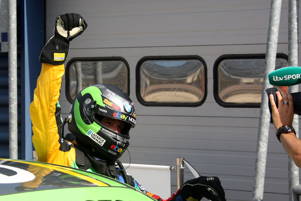 Colin Turkington wins the first race from Rockingham