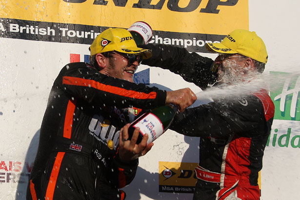 Rob Austin and Alain Menu help each other celebrate their success